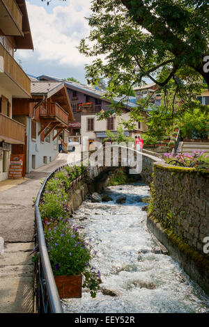 River and bridge in Megeve, Haute-Savoie, France, Europe Stock Photo