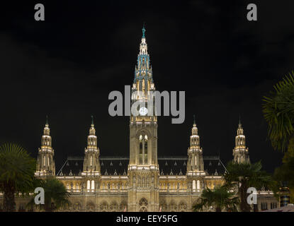 Facade of the town hall or Rathaus illuminated at night in Vienna, Austria Stock Photo