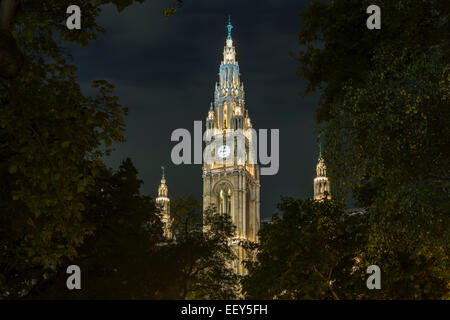 Facade of the town hall or Rathaus illuminated at night in Vienna, Austria Stock Photo