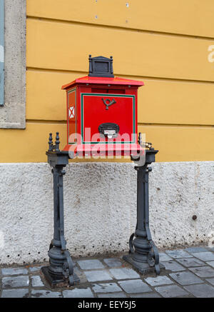 Traditional red Posta post box or mailbox in Castle District in Buda, Budapest, Hungary Stock Photo