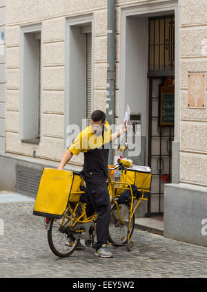 Postman Distributing Letters Postman with bicycle delivering letters on white background Stock Photo ...
