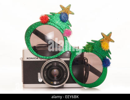 christmas tree sunglasses and vintage slr camera Stock Photo