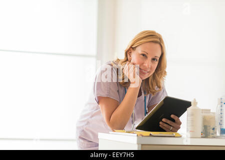 Female doctor using tablet pc Stock Photo