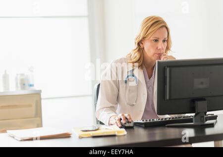 Female doctor using computer Stock Photo