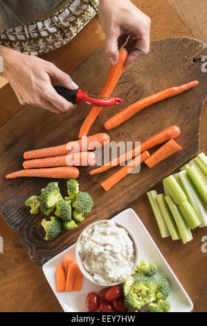 Woman preparing vegetables Stock Photo