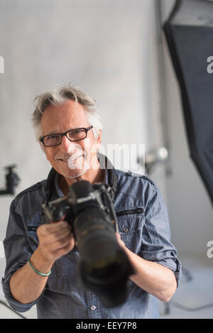 Portrait of photographer in his studio Stock Photo