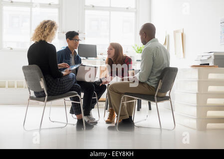 Friends having business meeting in office Stock Photo