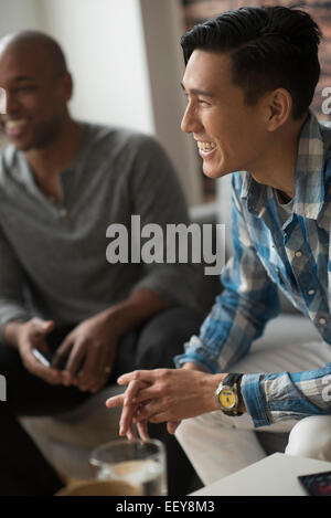 Man laughing during meeting with friends Stock Photo