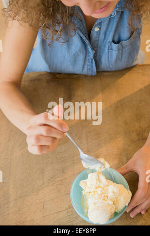 Elevated view of woman eating ice cream Stock Photo