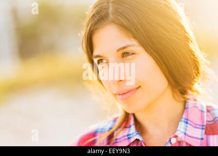 Portrait of young woman in sunlight Stock Photo