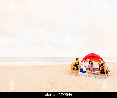USA, Florida, Jupiter, Young people relaxing on beach Stock Photo