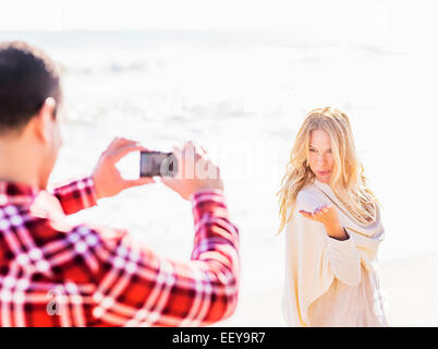 Man taking picture of woman Stock Photo