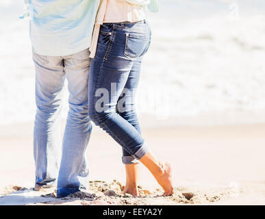 USA, Florida, Jupiter, Man and woman standing together on beach Stock Photo