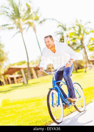 USA, Florida, Jupiter, Man riding bike Stock Photo