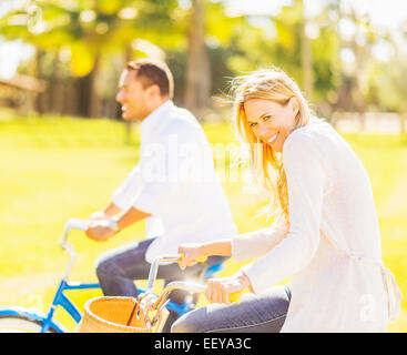 USA, Florida, Jupiter, Couple riding on bikes Stock Photo