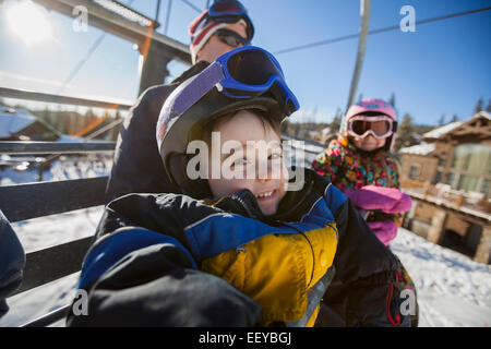 USA, Montana, Whitefish, Father skiing with children (6-7, 8-9) Stock Photo