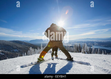 USA, Montana, Whitefish, Father skiing with son (6-7) Stock Photo