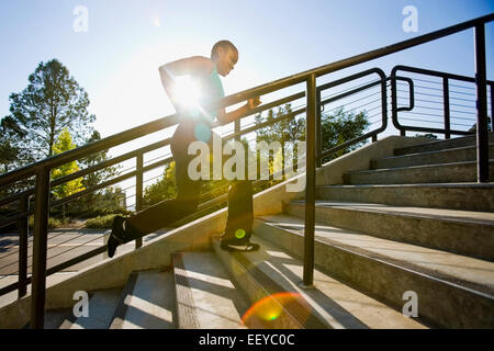 USA, California, Berkeley, Woman running on steps Stock Photo