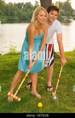 Couple playing croquet Stock Photo