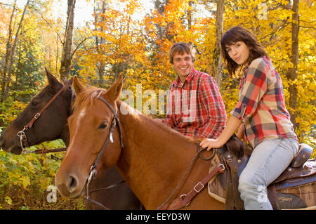Horseback riders on an autumn day Stock Photo