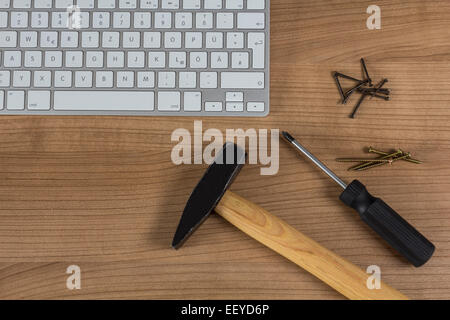 Modern keyboard and tools on a wooden Desktop Stock Photo