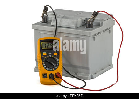 Checking voltage of automotive battery, isolated on white background Stock Photo