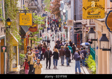 QUEBEC CITY, QUEBEC, CANADA - Tourism on Petit Champlain Street, in Old Quebec City. People walk along narrow street shopping Stock Photo