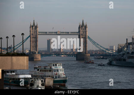 LONDON - OCTOBER 03: London Tower Bridge and HMS Belfast on October 03, 2014 in London, UK. London is one of the world's leading Stock Photo
