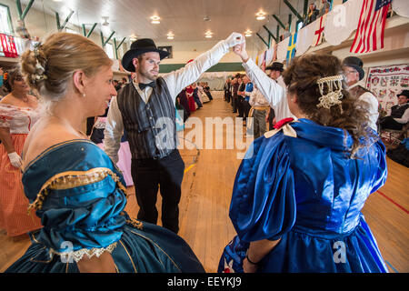 Tourists and Montanans gather for the 1864 Grand Victorian Ball for Montana Territory on June 21, 2014 in Virginia City, Montana.  The Balls started with a Promenade down the Virginia City Boardwalk and the Grand March began in the Ballroom. (Photo by Ami Vitale) Stock Photo