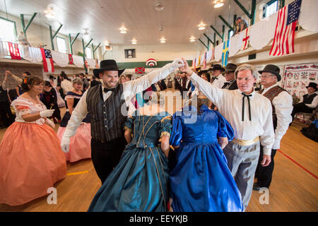 Tourists and Montanans gather for the 1864 Grand Victorian Ball for Montana Territory on June 21, 2014 in Virginia City, Montana.  The Balls started with a Promenade down the Virginia City Boardwalk and the Grand March began in the Ballroom. (Photo by Ami Vitale) Stock Photo