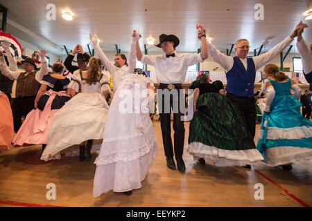 Tourists and Montanans gather for the 1864 Grand Victorian Ball for Montana Territory on June 21, 2014 in Virginia City, Montana.  The Balls started with a Promenade down the Virginia City Boardwalk and the Grand March began in the Ballroom. (Photo by Ami Vitale) Stock Photo