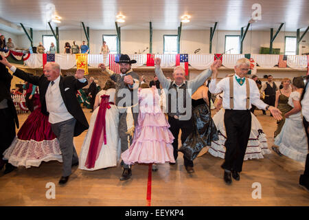 Tourists and Montanans gather for the 1864 Grand Victorian Ball for Montana Territory on June 21, 2014 in Virginia City, Montana.  The Balls started with a Promenade down the Virginia City Boardwalk and the Grand March began in the Ballroom. (Photo by Ami Vitale) Stock Photo