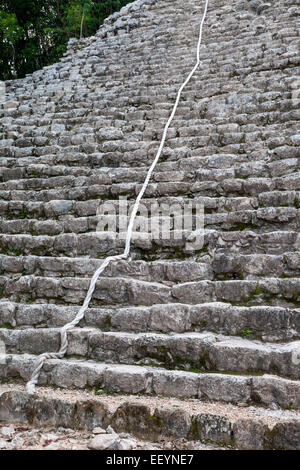 Nohoch Mul, main pyramid at Coba Ruins, near Playa del Carmen, Mexico.  The rope assists climbers in making their way to the top Stock Photo