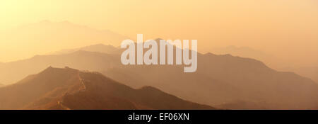 Great Wall panorama in the morning with sunrise and colorful sky in Beijing, China. Stock Photo