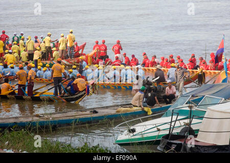 Men are gathered in racing boats at the annual Phnom Penh Water Festival on the Mekong river in Phnom Penh, Cambodia. Stock Photo