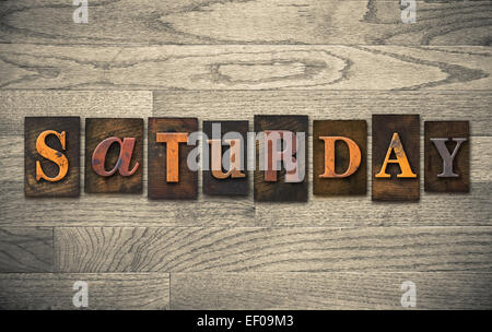 The word 'SATURDAY' written in vintage wooden letterpress type. Stock Photo
