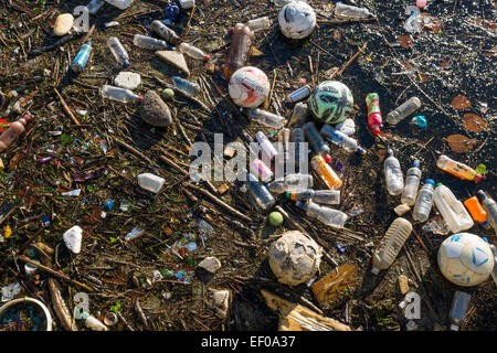 Rubbish floating on surface of water Stock Photo