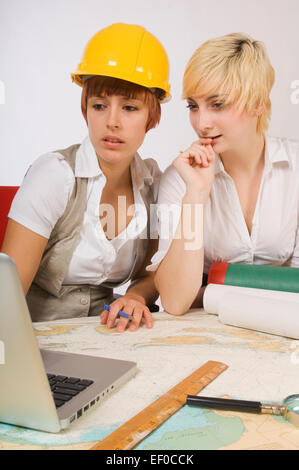 Two women looking at laptop Stock Photo