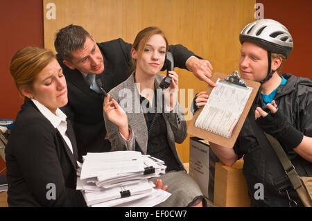 Overworked office receptionist Stock Photo