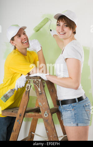 Couple painting wall Stock Photo