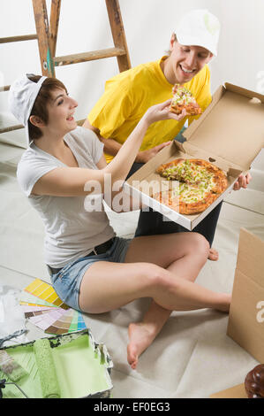 Couple eating pizza Stock Photo