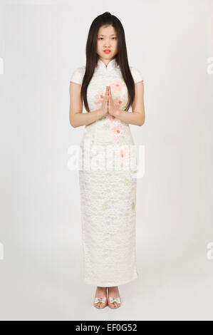 Portrait of a beautiful young woman wearing a white Asian dress Stock Photo