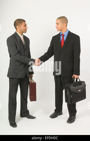 Businessmen shaking hands Stock Photo