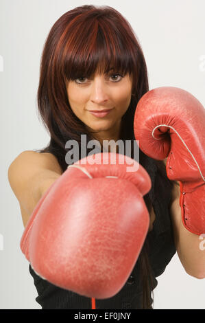 Woman wearing boxing gloves Stock Photo