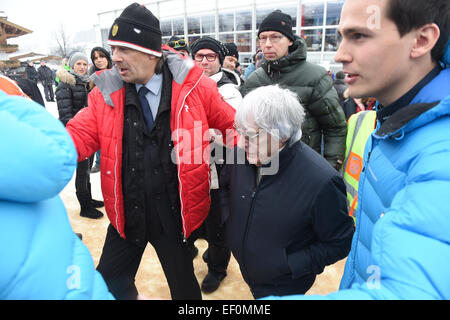 Kitzbuehl, Austria. 24th Jan, 2015. Formula One boss Bernie Ecclestone (C) visits the Hahnenkamm Race in Kitzbuehl, Austria, 24 January 2015. On the occasion of the annual Hahnenkamm-Race, celebrities meet up in the renowned Skiing-Capital. PHOTO: FELIX HOERHAGER/dpa/Alamy Live News Stock Photo