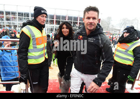 Kitzbuehl, Austria. 24th Jan, 2015. Extreme sports athlete Felix Baumgartner and his company Mihaela Schwartzenberg visit the Hahnenkamm Race in Kitzbuehl, Austria, 24 January 2015. On the occasion of the annual Hahnenkamm-Race, celebrities meet up in the renowned Skiing-Capital. PHOTO: FELIX HOERHAGER/dpa/Alamy Live News Stock Photo