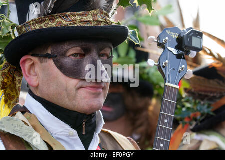 Musician wearing leather eye & nose mask at Nantwich, Cheshire, UK. 24th Jan, 2015. Penkhull Domesday Morris dancers at the Holly Holy Day & Siege of Nantwich re-enactment. Holly Holy Day commemorates the lifting of the Siege of Nantwich during the English Civil War on 25th January 1644 and the name is derived from the locals wearing sprigs of holly in their hats to celebrate. The commemoration dates back over 40 years when a holly wreath-laying ceremony began organised by the Nantwich History Society. Stock Photo
