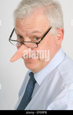Businessman with a very long nose Stock Photo
