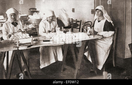 Women volunteers making hospital requisites for the St. John Ambulance Brigade Hospital during World War One. Stock Photo