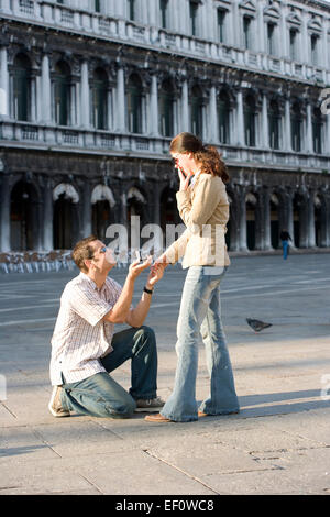 Man proposing marriage in St Mark's Square ,Venice Italy Stock Photo